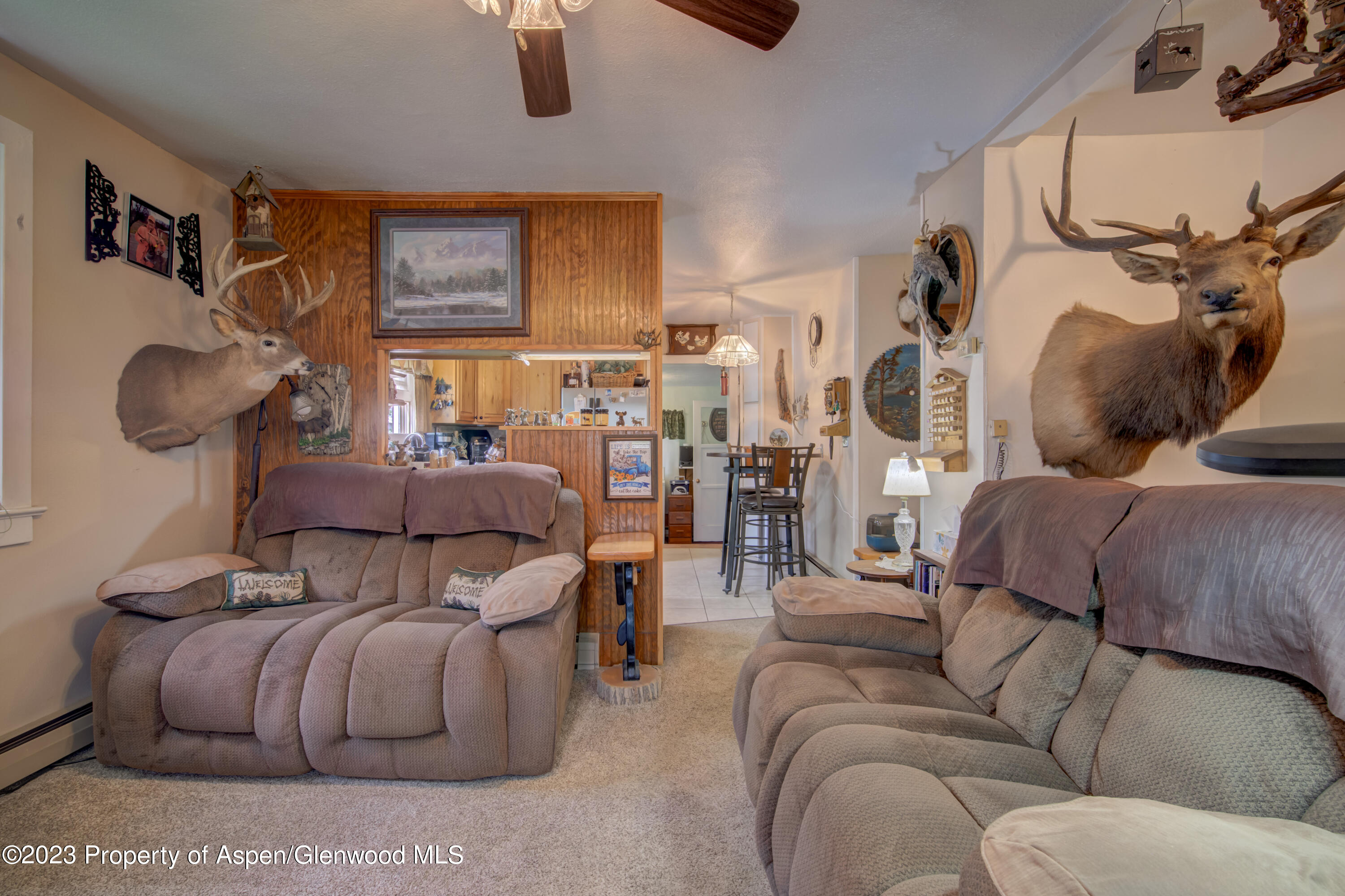 690 Pershing Street Craig, CO 81625 - Photo 26 of 72 a living room with furniture and a large window