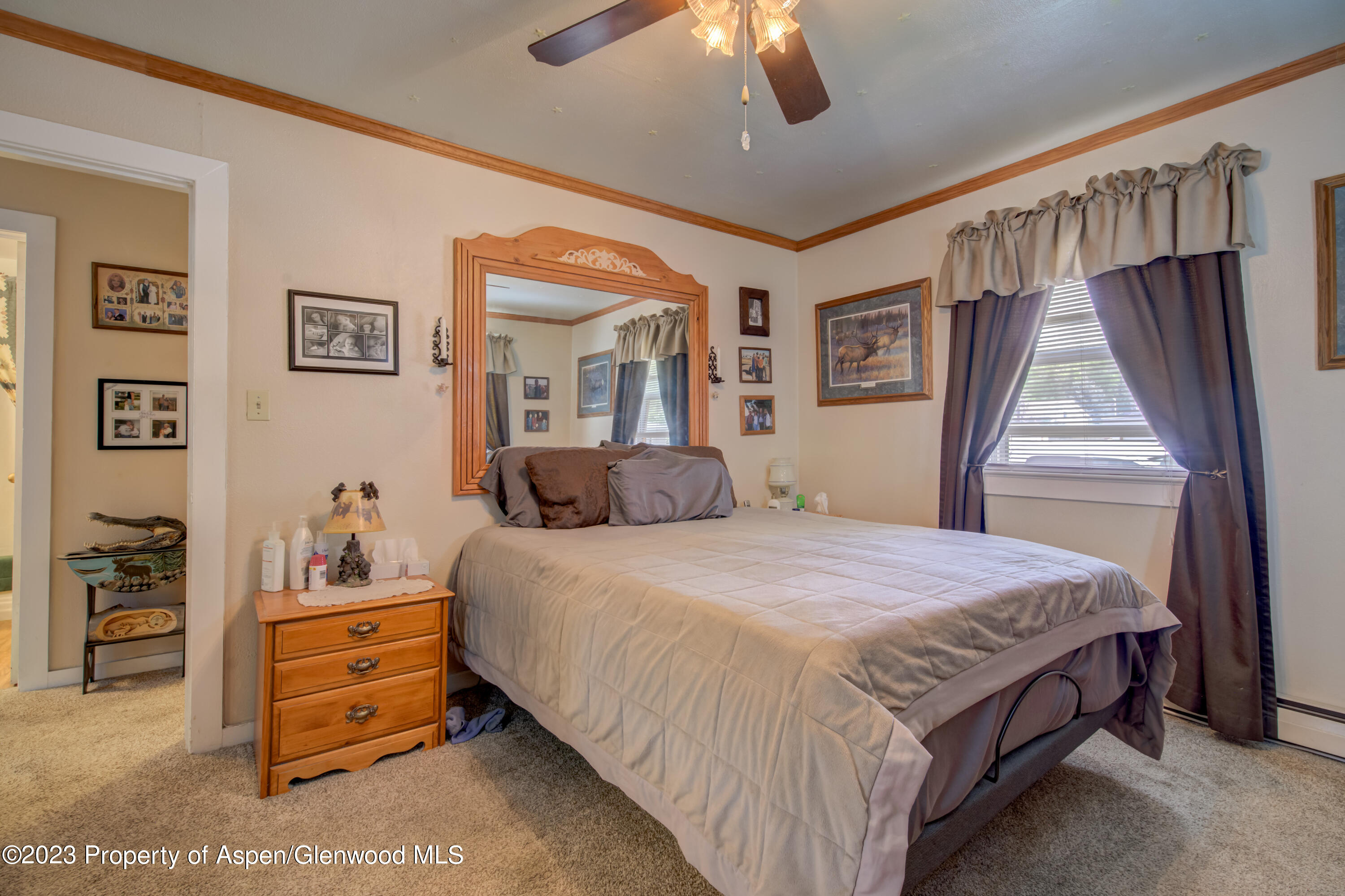 690 Pershing Street Craig, CO 81625 - Photo 38 of 72 a bedroom with a bed and a dresser