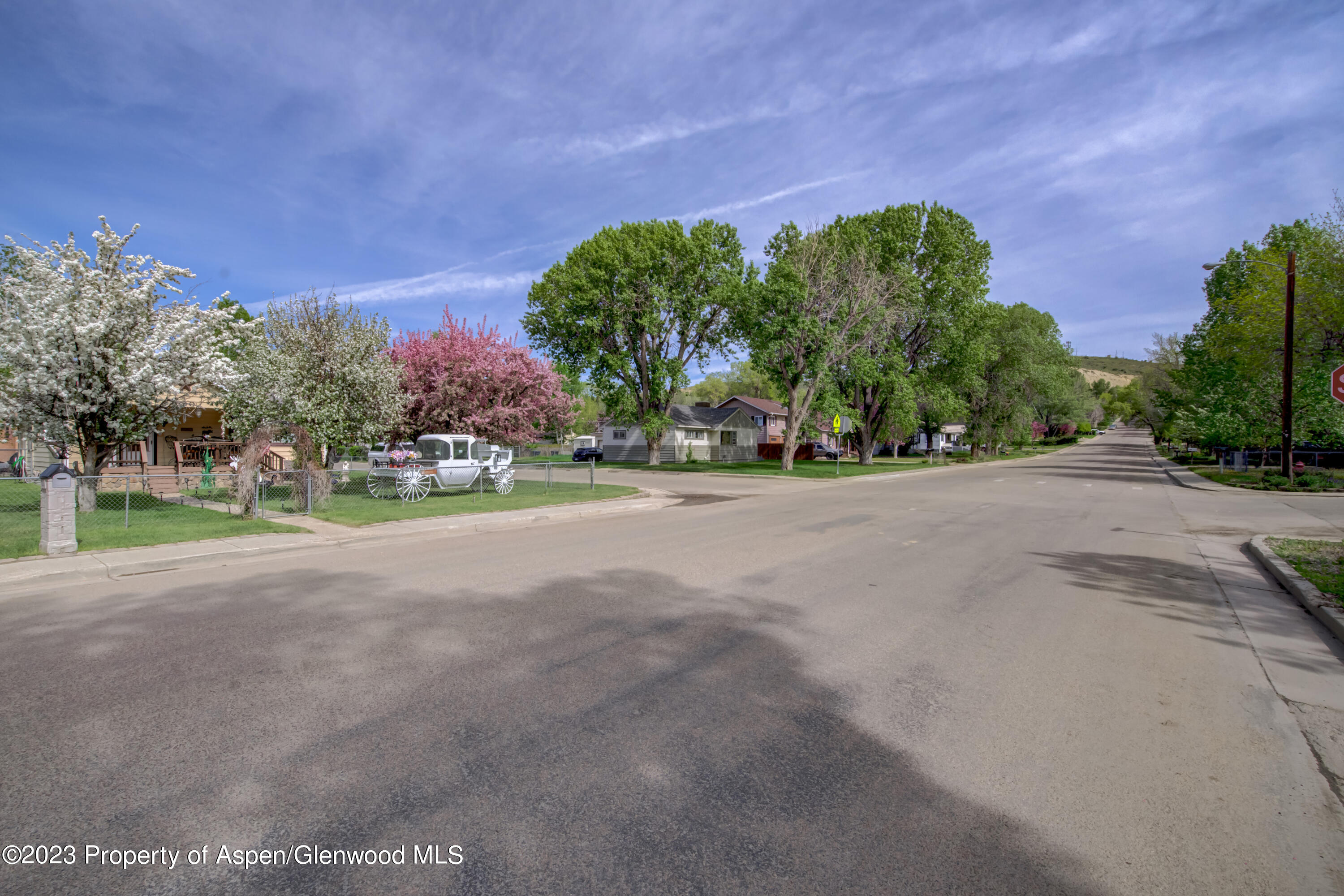 690 Pershing Street Craig, CO 81625 - Photo 5 of 72 a front view of a house with a yard and a road
