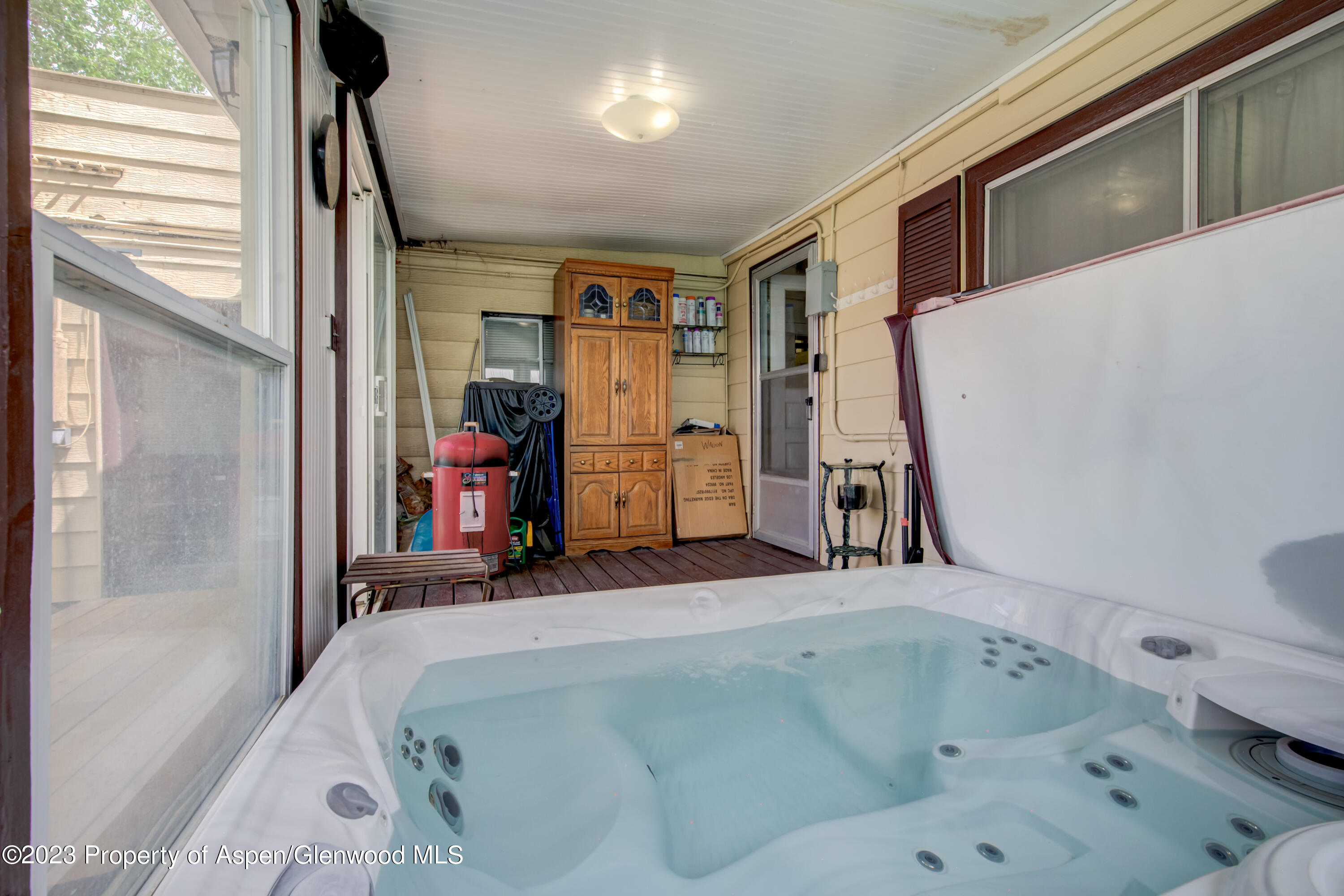 690 Pershing Street Craig, CO 81625 - Photo 52 of 72 a bathroom with a tub sink and a large mirror