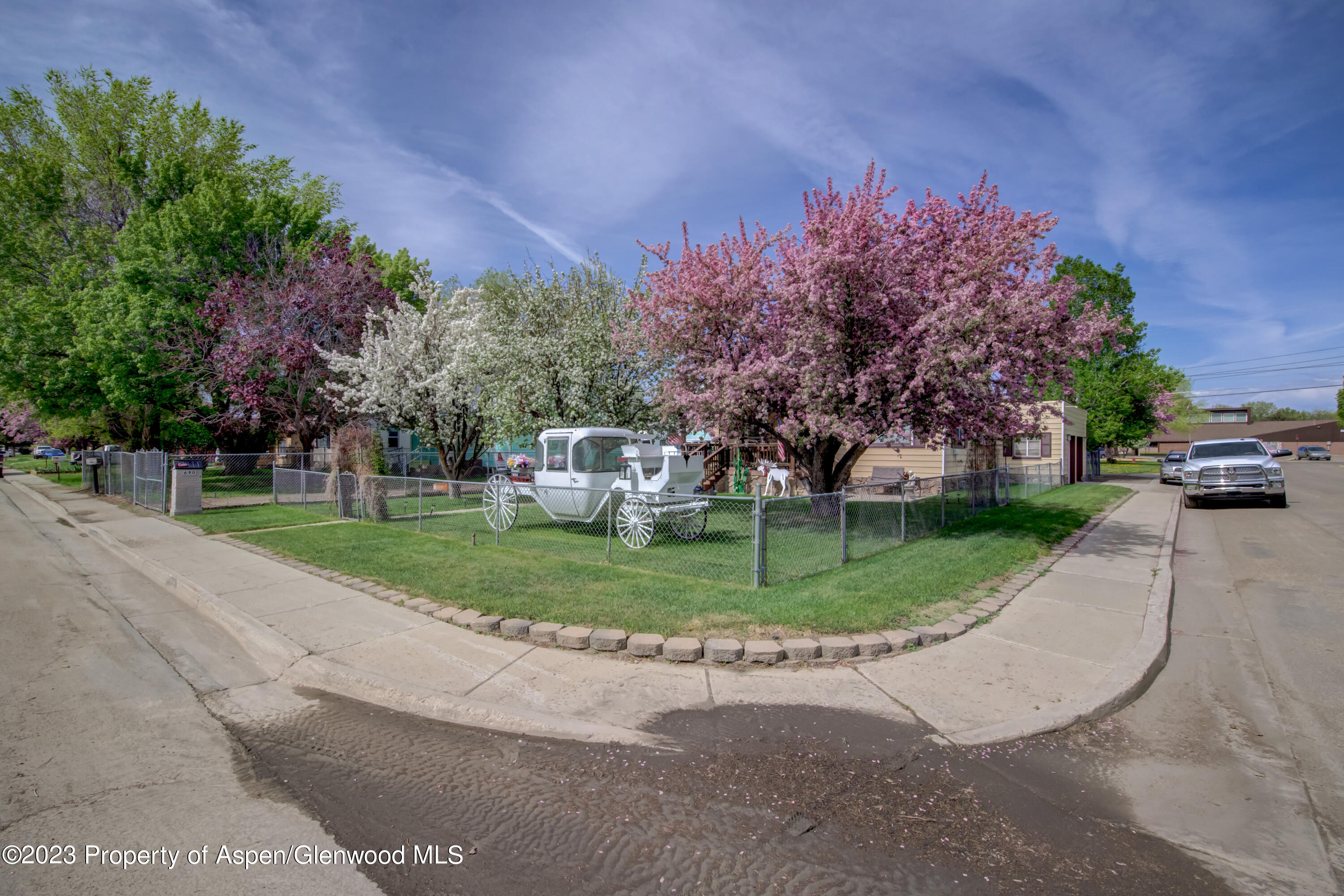 690 Pershing Street Craig, CO 81625 - Photo 6 of 72 a front view of a house with a yard and garage