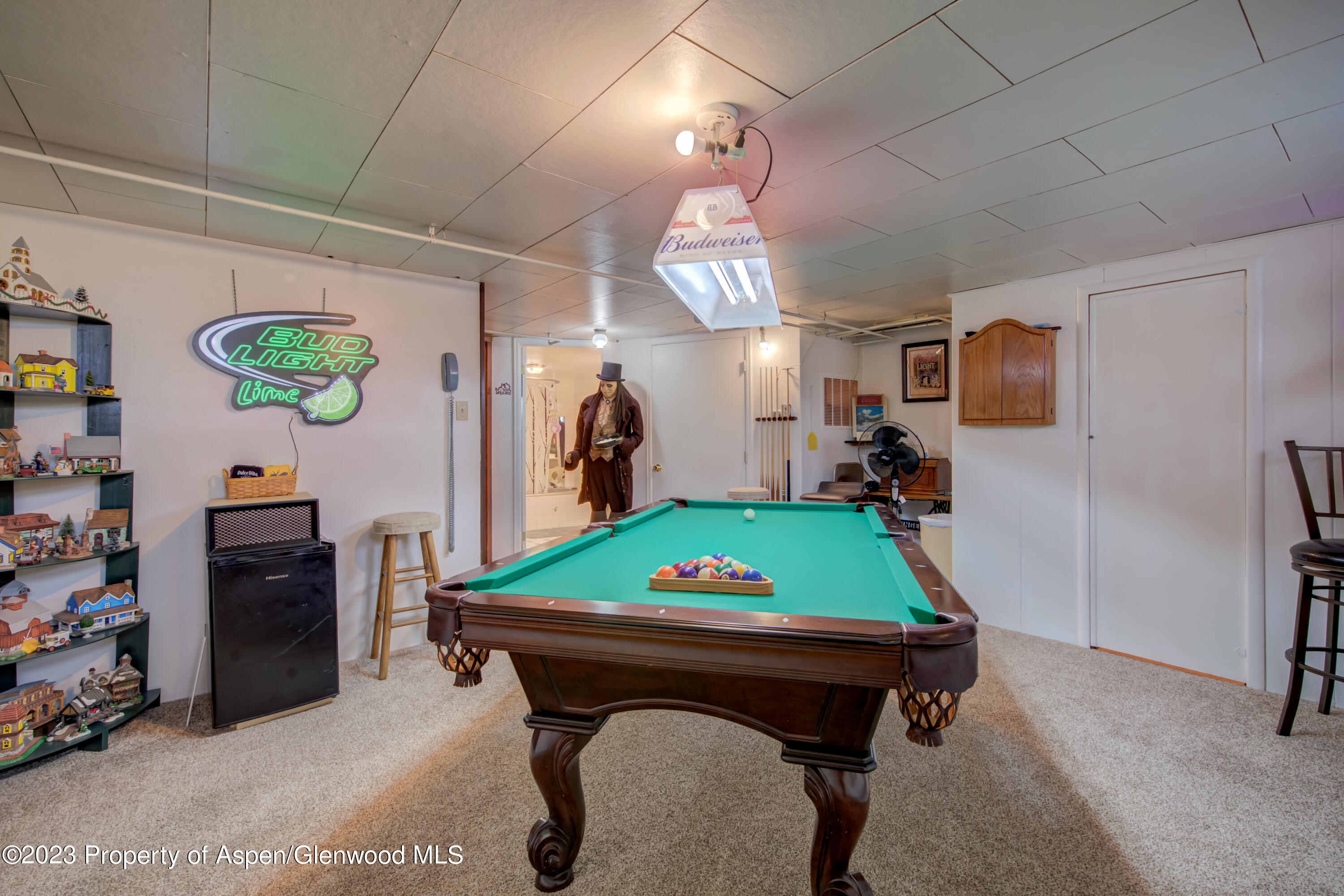 690 Pershing Street Craig, CO 81625 - Photo 64 of 72 a room with pool table and a flat screen tv
