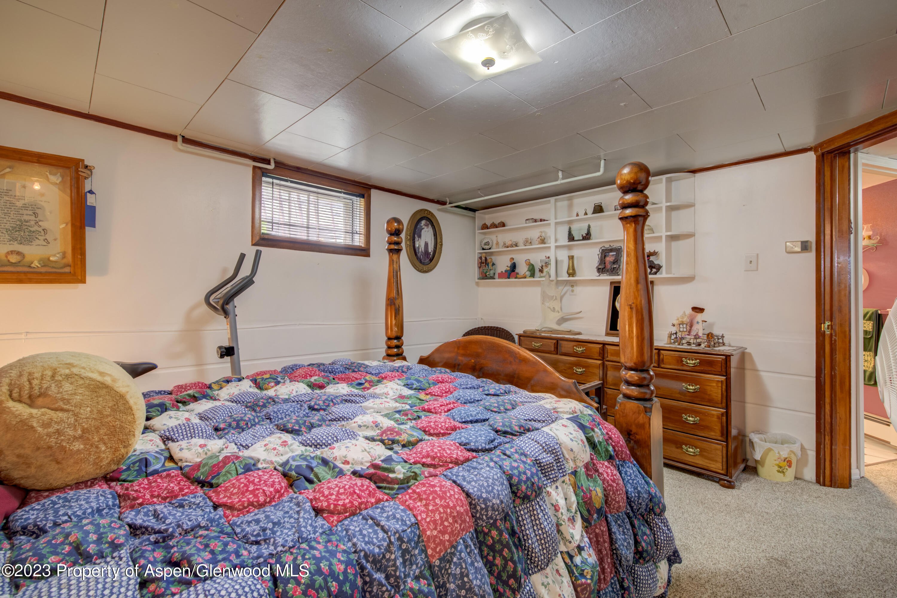 690 Pershing Street Craig, CO 81625 - Photo 69 of 72 a bedroom with a bed and a closet