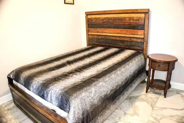 a bedroom with a bed and a cabinets