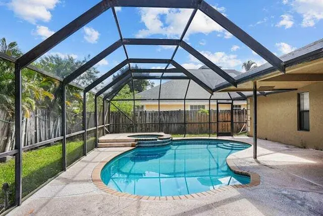 a view of a swimming pool with a patio