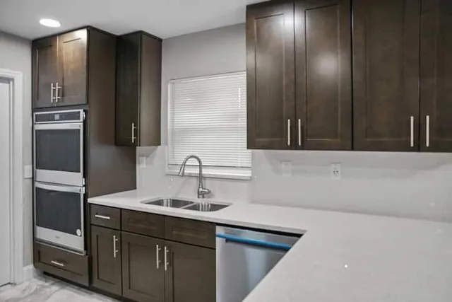 a kitchen with a sink and refrigerator