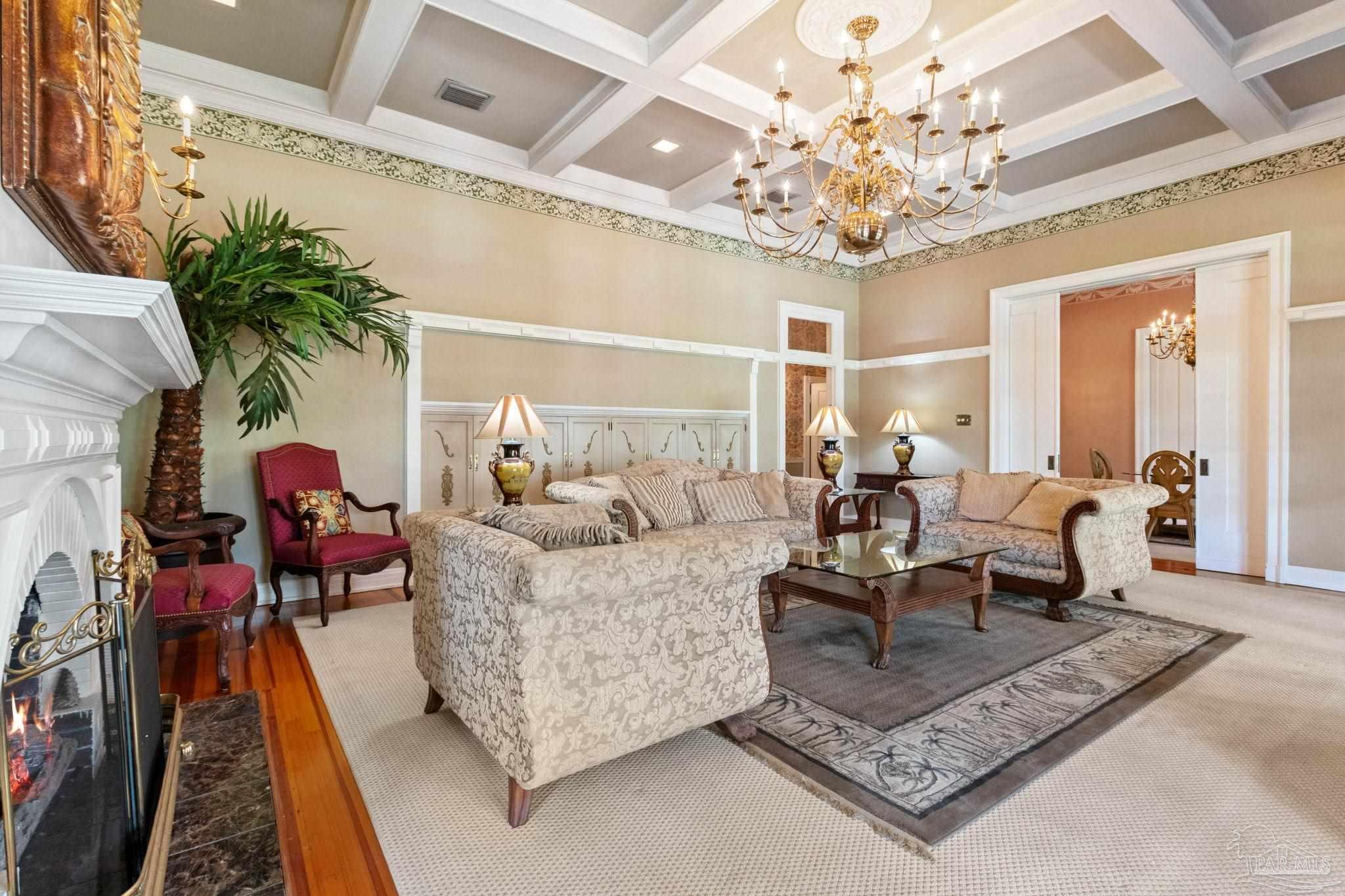 1701 Sowell Road Brewton, AL 36426 - Photo 22 of 72 a living room with furniture and a chandelier