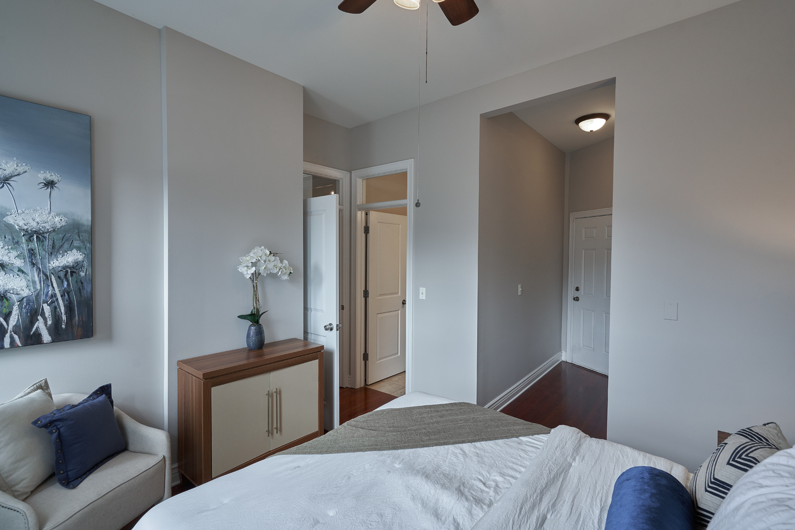 2801 North Seminary Avenue, Unit 1S Chicago, IL 60657 - Photo 14 of 21 a bedroom with a bed and a chandelier