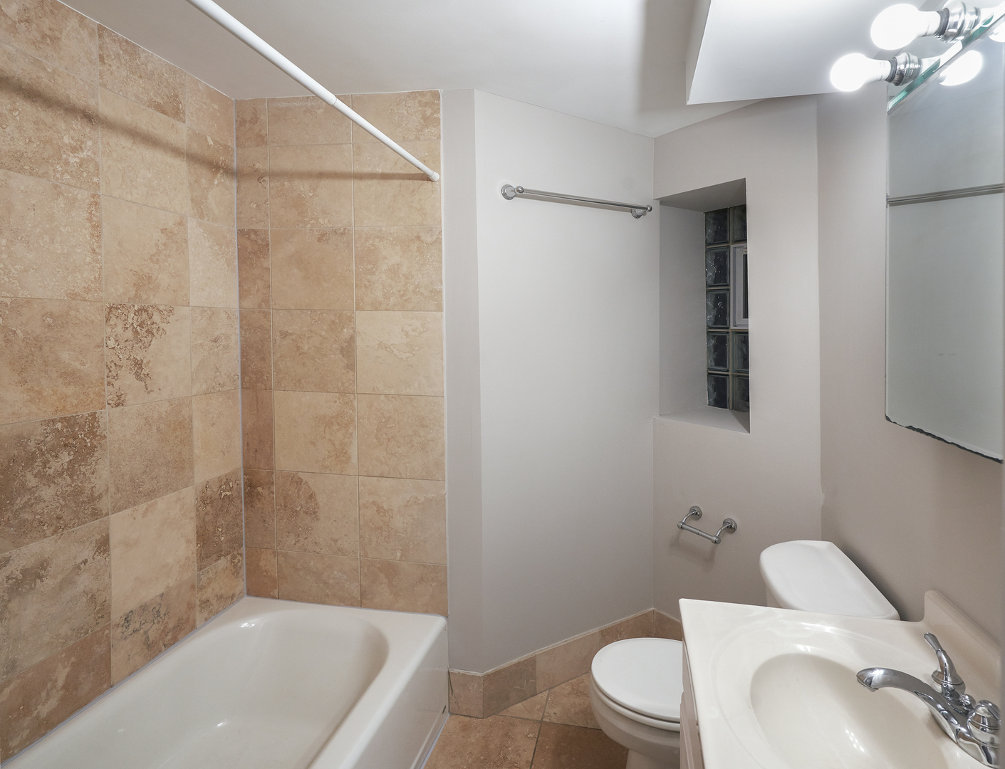 2801 North Seminary Avenue, Unit 1S Chicago, IL 60657 - Photo 21 of 21 a view of a bathroom with a tub and toilet