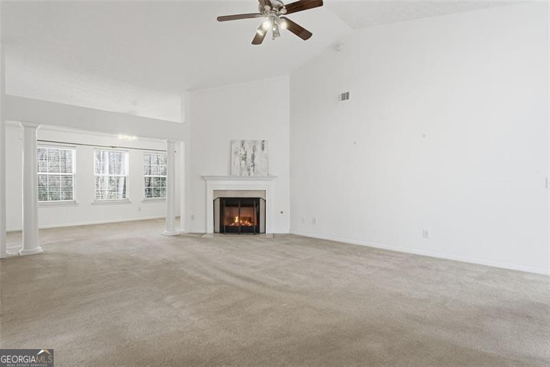 6214 Tree Ridge Dr N West Acworth, GA 30101 - Photo 11 of 41 an empty room with fireplace and windows