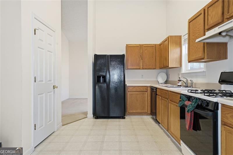 6214 Tree Ridge Dr N West Acworth, GA 30101 - Photo 16 of 41 a kitchen with stainless steel appliances granite countertop a refrigerator and a stove
