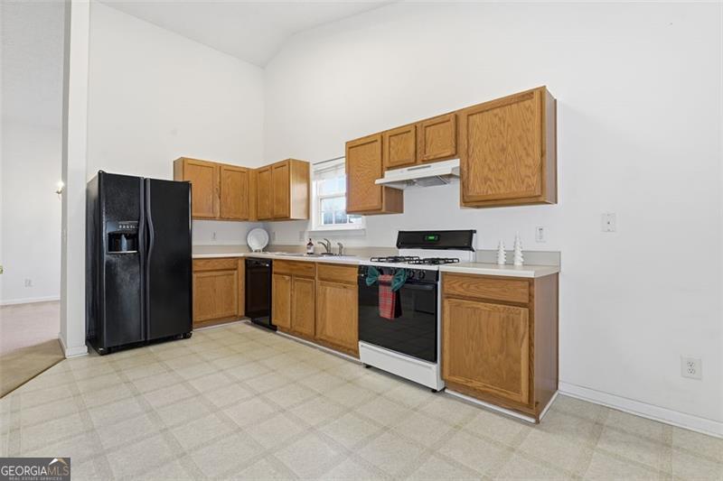 6214 Tree Ridge Dr N West Acworth, GA 30101 - Photo 17 of 41 a kitchen with stainless steel appliances a refrigerator and a stove