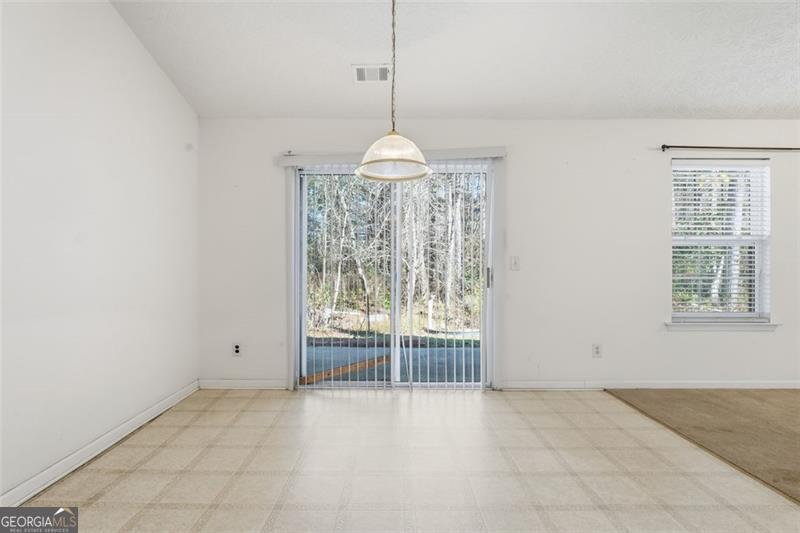 6214 Tree Ridge Dr N West Acworth, GA 30101 - Photo 18 of 41 an empty room with windows and outdoor view