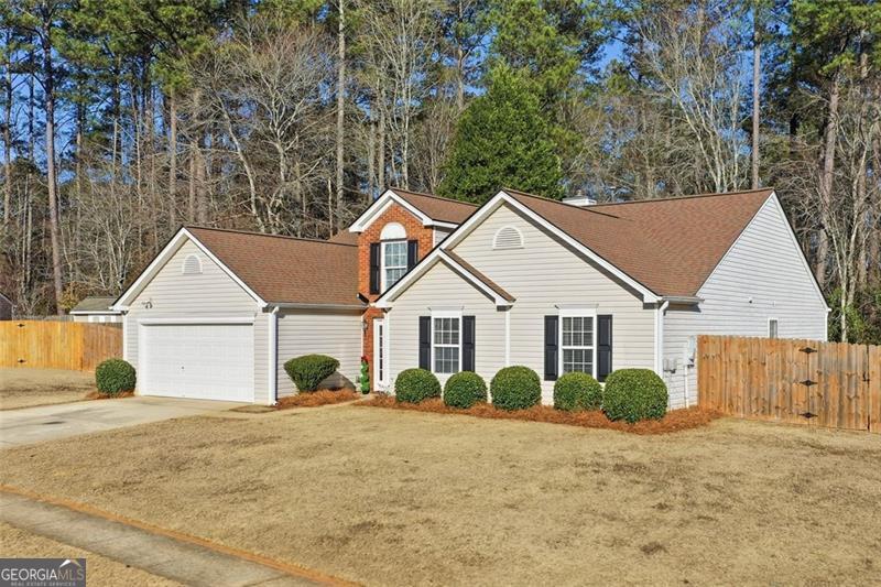 6214 Tree Ridge Dr N West Acworth, GA 30101 - Photo 2 of 41 a view of a house with a yard and large trees