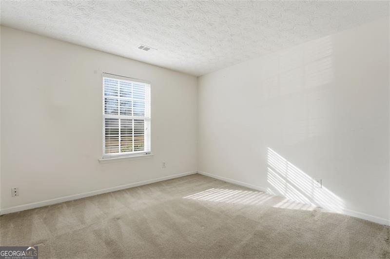 6214 Tree Ridge Dr N West Acworth, GA 30101 - Photo 22 of 41 an empty room with a window