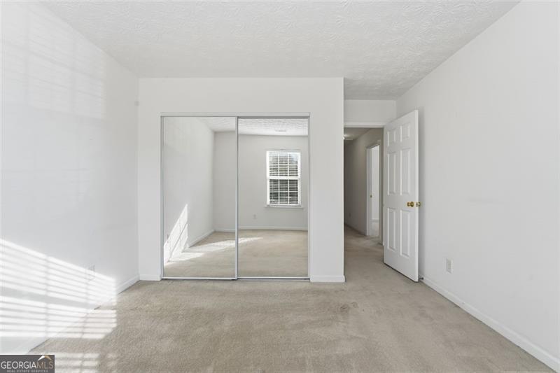 6214 Tree Ridge Dr N West Acworth, GA 30101 - Photo 24 of 41 an empty room with a fireplace