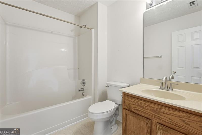 6214 Tree Ridge Dr N West Acworth, GA 30101 - Photo 30 of 41 a bathroom with a sink toilet and shower