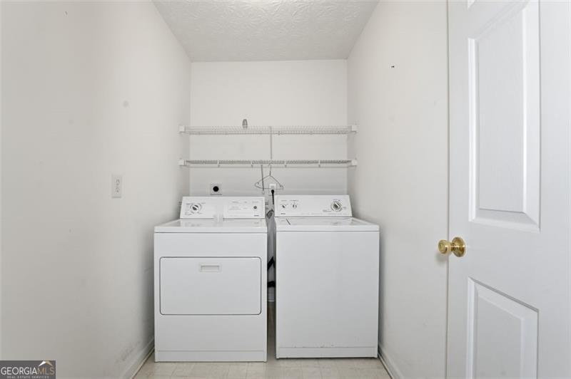 6214 Tree Ridge Dr N West Acworth, GA 30101 - Photo 31 of 41 a utility room with dryer and washer