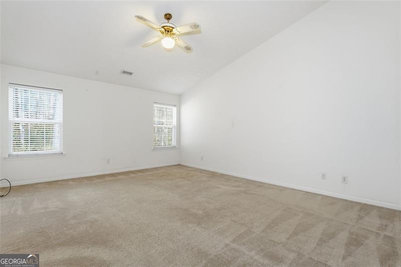 6214 Tree Ridge Dr N West Acworth, GA 30101 - Photo 32 of 41 an empty room with a window and a ceiling fan