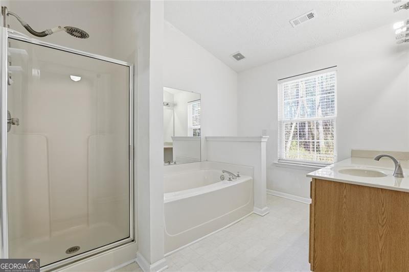 6214 Tree Ridge Dr N West Acworth, GA 30101 - Photo 36 of 41 a bathroom with a tub a sink and a shower
