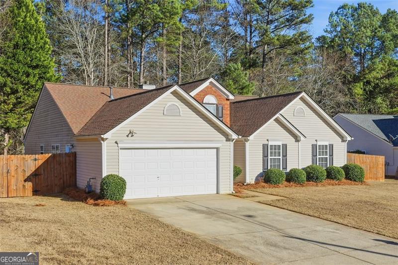 6214 Tree Ridge Dr N West Acworth, GA 30101 - Photo 41 of 41 a front view of a house with a yard and trees