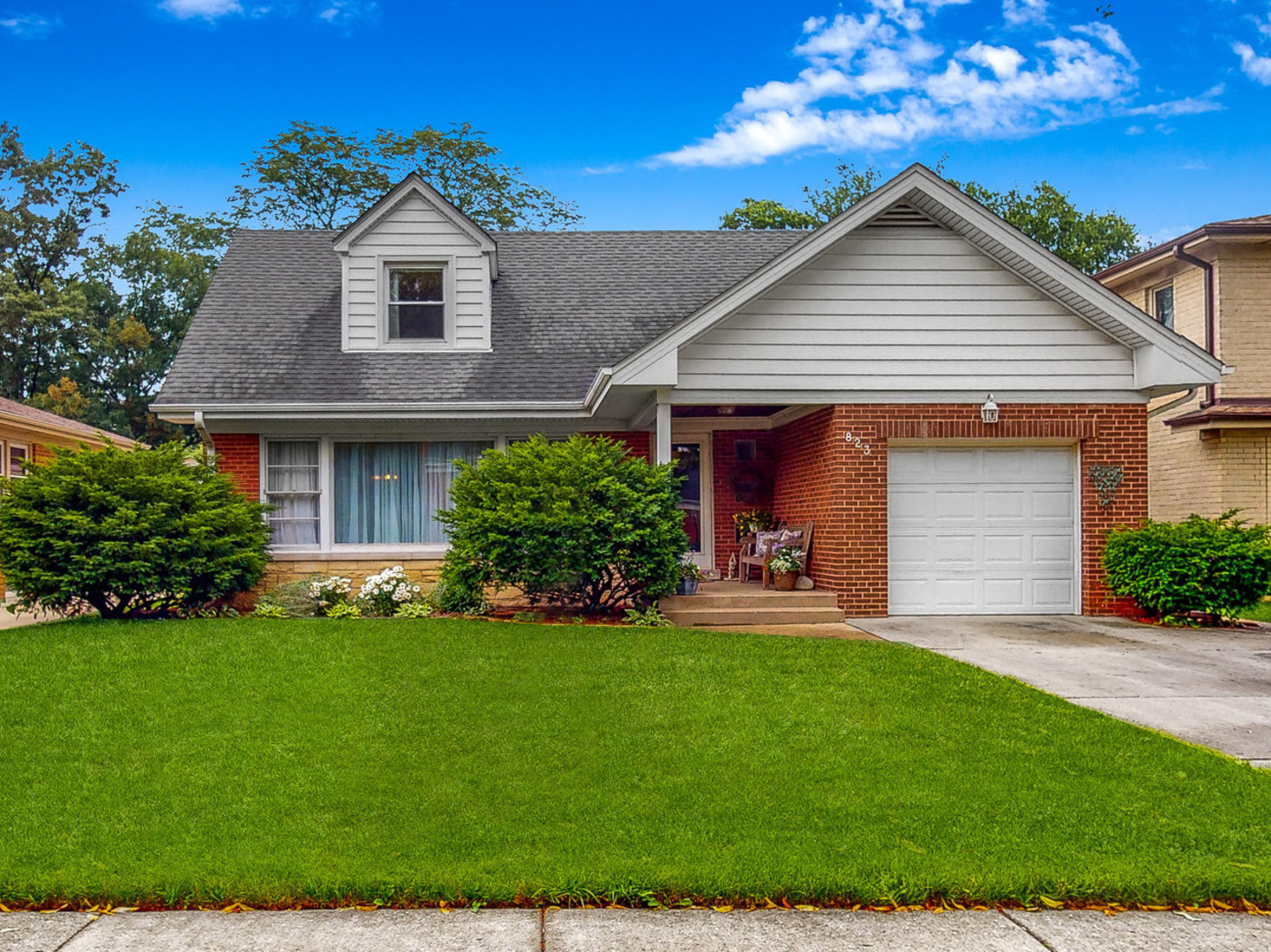 823 South Western Avenue Park Ridge, IL 60068 - Photo 1 of 39 a front view of a house with a yard and garage