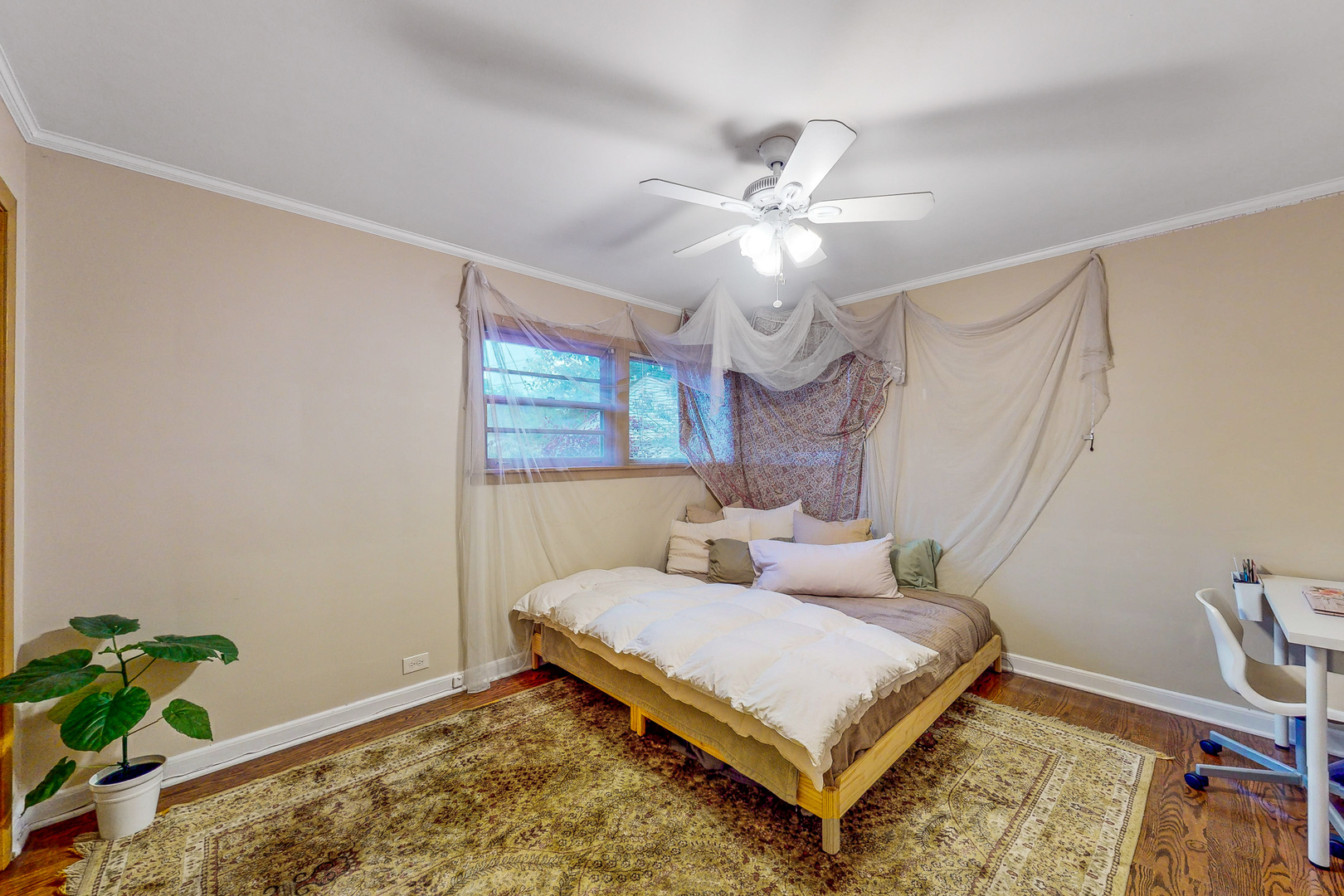 823 South Western Avenue Park Ridge, IL 60068 - Photo 18 of 39 a bedroom with furniture and a chandelier