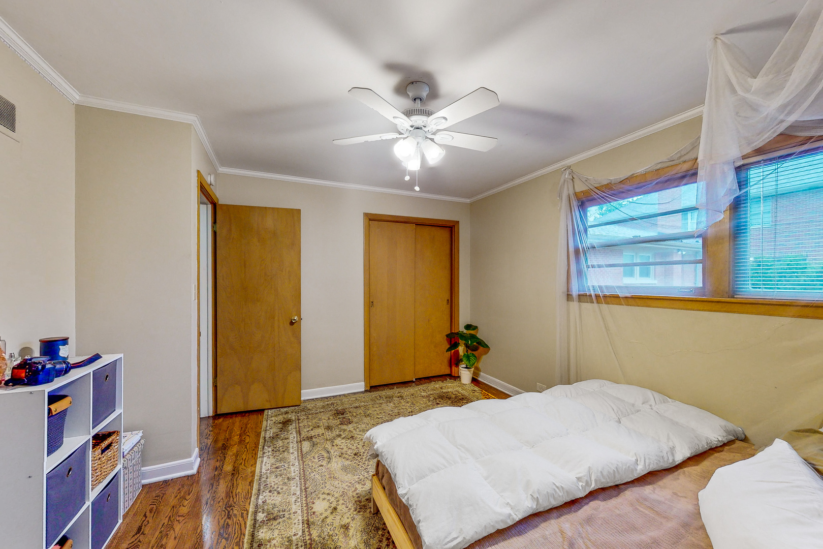 823 South Western Avenue Park Ridge, IL 60068 - Photo 19 of 39 a bedroom with a bed and a chandelier