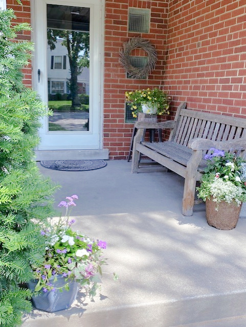 823 South Western Avenue Park Ridge, IL 60068 - Photo 2 of 39 a garden with a bench and potted plants