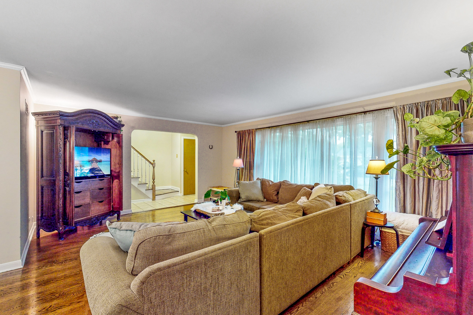 823 South Western Avenue Park Ridge, IL 60068 - Photo 4 of 39 a living room with furniture a window and a flat screen tv