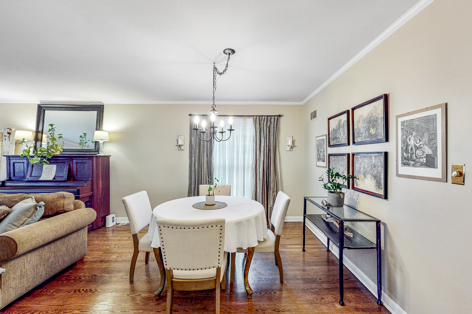823 South Western Avenue Park Ridge, IL 60068 - Photo 7 of 39 a view of a dining room with furniture wooden floor and a chandelier