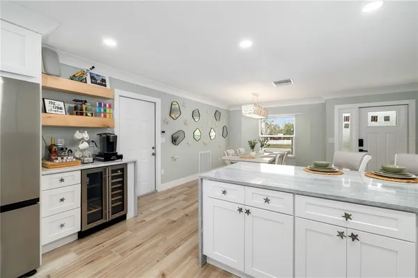a kitchen with stainless steel appliances granite countertop a stove cabinets and wooden floor