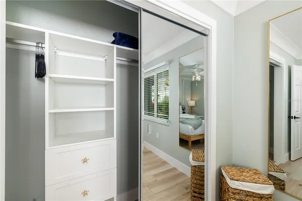 a bedroom with a bed and a couch