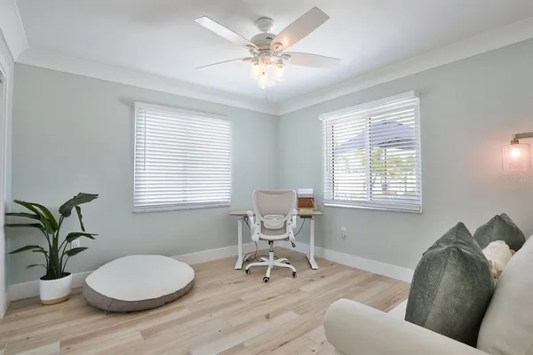 a spacious bedroom with a bed and a table