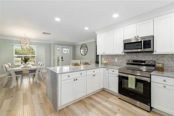 a kitchen with a stove and a microwave