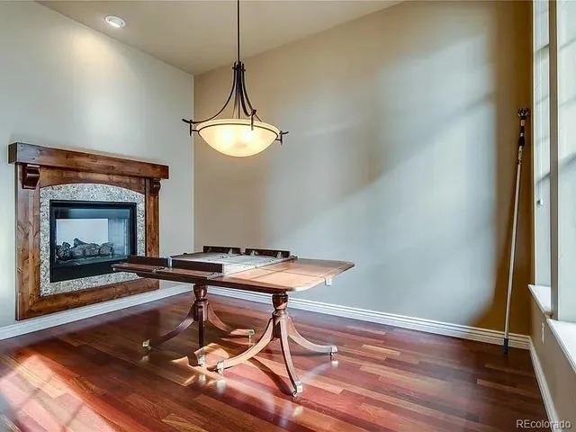 a workspace with furniture and a fireplace