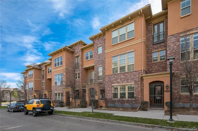 a car parked in front of brick building