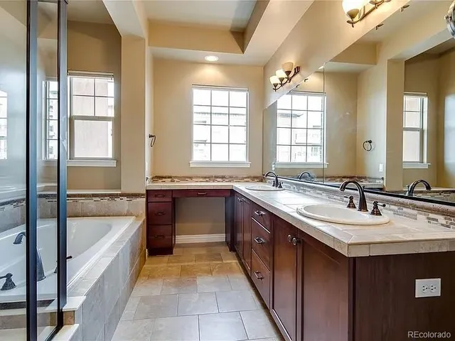 a bathroom with a bathtub and a sink