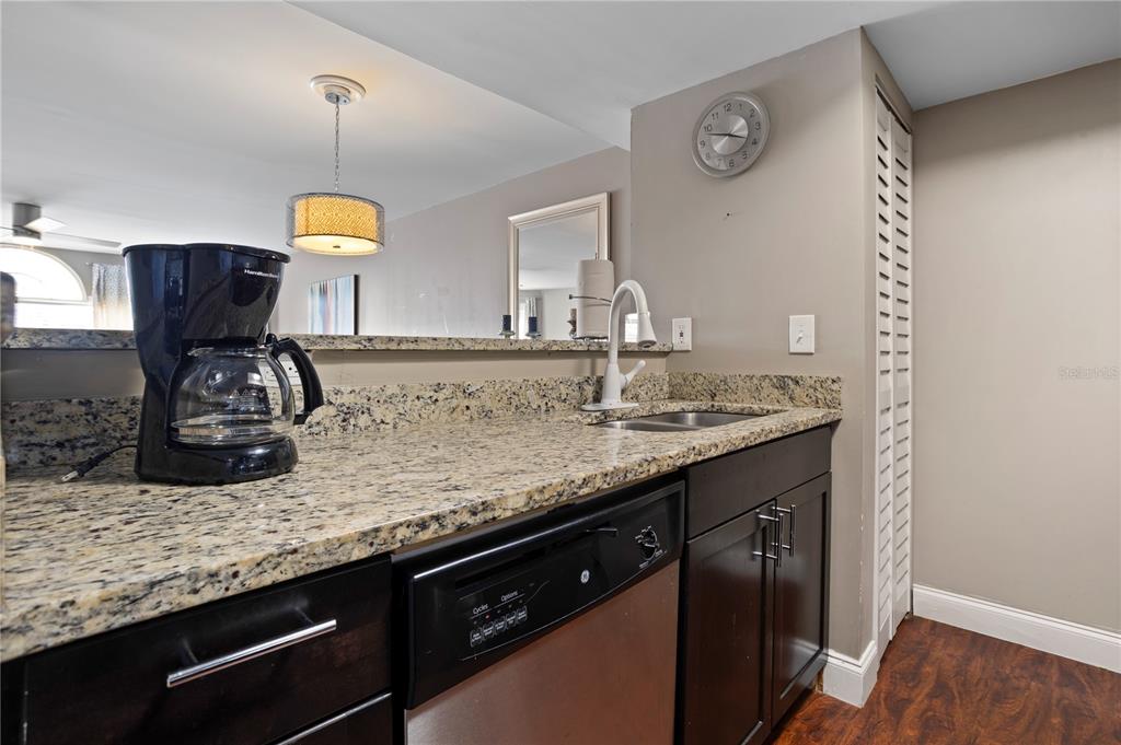 2749 North Poinciana Boulevard, Unit 15 Kissimmee, FL 34746 - Photo 12 of 36 a kitchen with sink and window