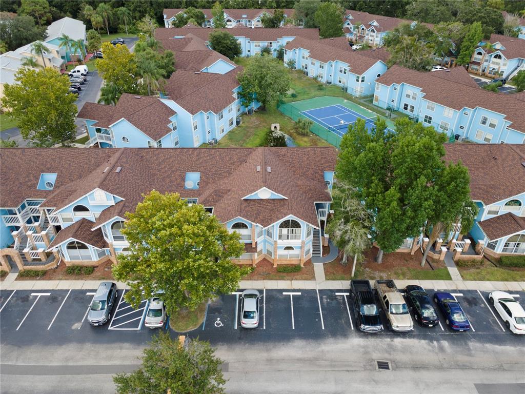 2749 North Poinciana Boulevard, Unit 15 Kissimmee, FL 34746 - Photo 2 of 36 an aerial view of a house with garden space and street view
