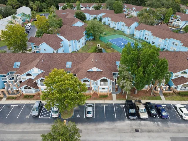 an aerial view of a house with garden space and street view