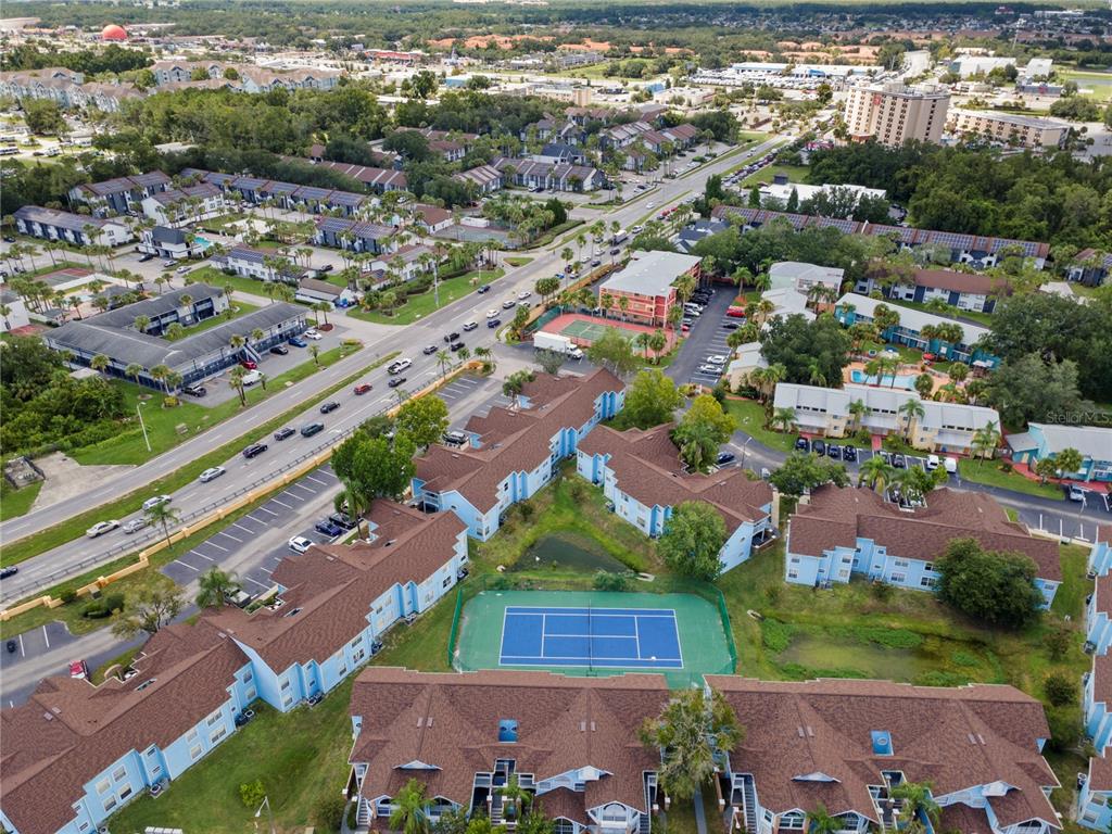 2749 North Poinciana Boulevard, Unit 15 Kissimmee, FL 34746 - Photo 36 of 36 an aerial view of residential houses with outdoor space