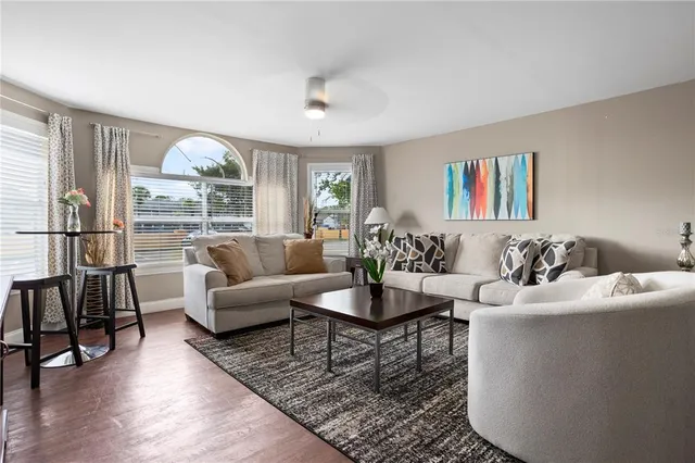 a living room with furniture and a large window