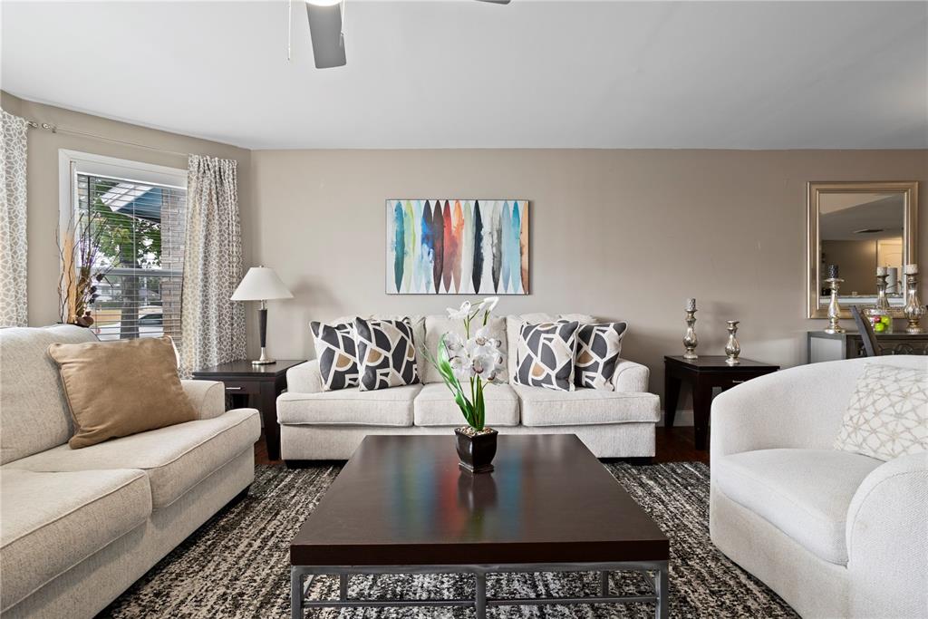 2749 North Poinciana Boulevard, Unit 15 Kissimmee, FL 34746 - Photo 6 of 36 a living room with furniture and wooden floor