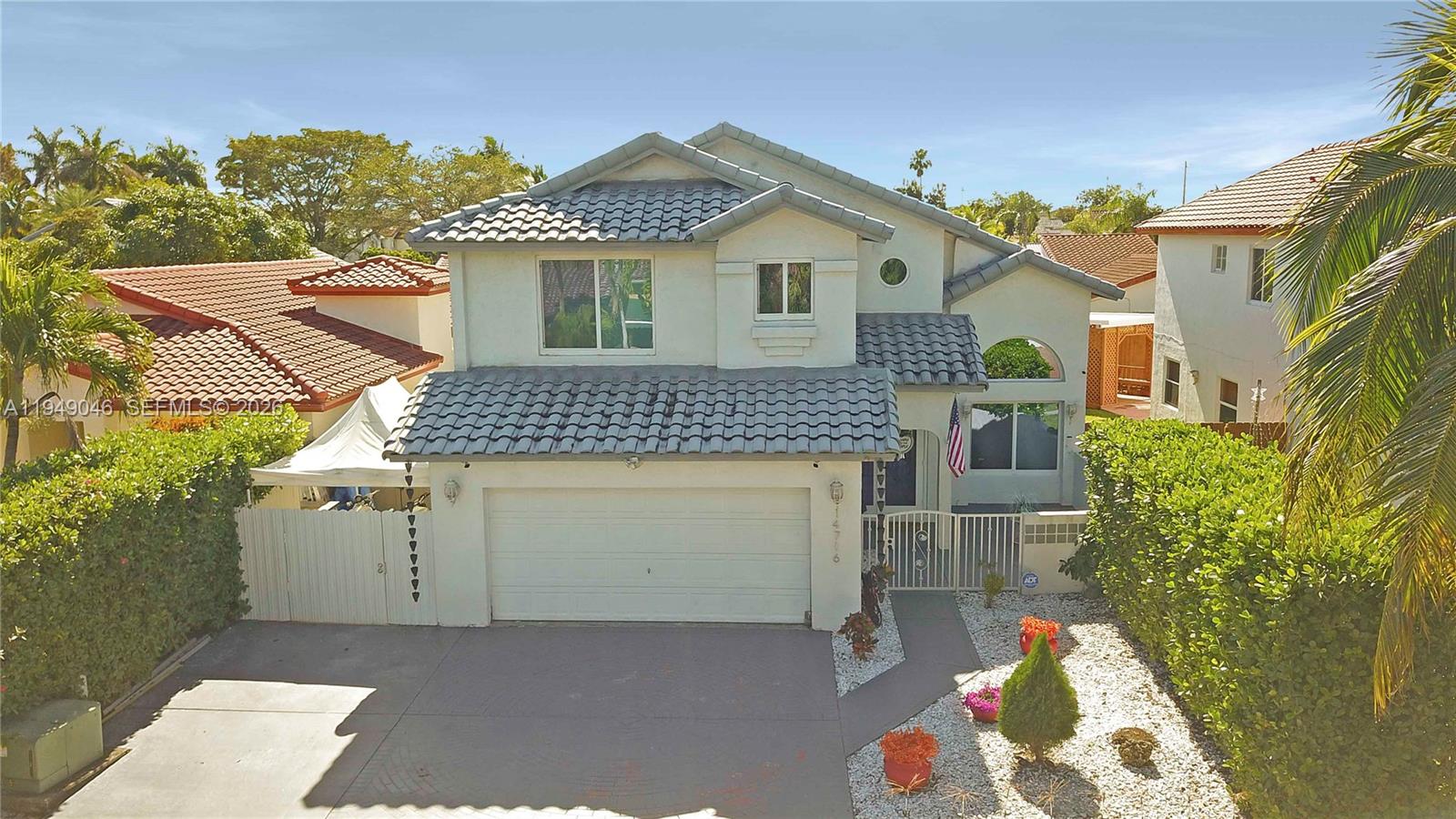 a front view of a house with a garage