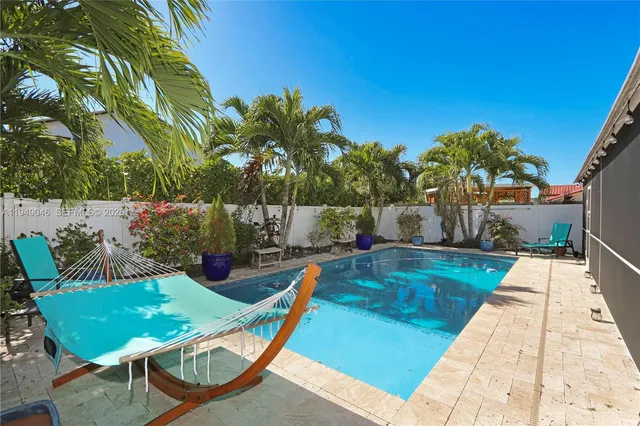 a view of a swimming pool with a patio