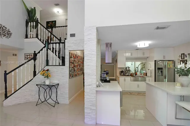 a lobby with furniture and rug