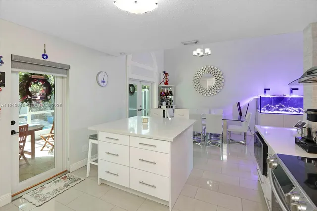 a room with a cabinets and a chair