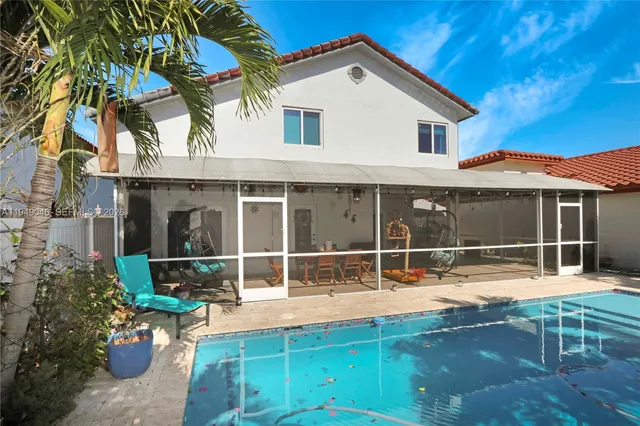 a backyard of a house with outdoor seating