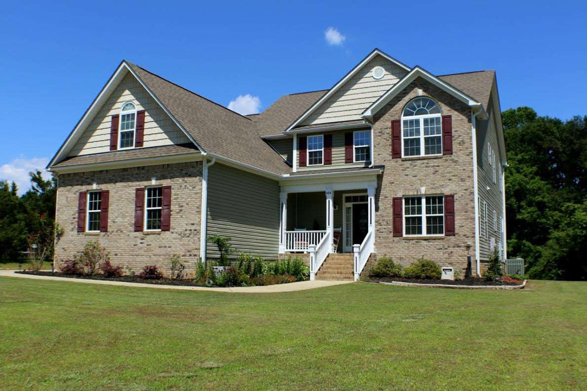 820 Hood Farm Road Clayton, NC 27520 - Photo 20 of 20 A long driveway leads you to this beautiful CUSTOM BUILT 4-5 Bedroom, 3 & 1/2 Bath home with a SIDE ENTRY 2 car GARAGE, covered front porch, SCREENED PORCH, & 2.2 ACRES of wonderful outdoor space! Exterior Front